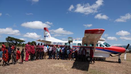 Veterinary doctors from the United States of America, pose for a photo with the Maasai after landing at Enairebuk airstrip.          