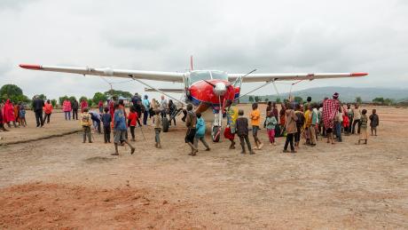 Kids excited about the MAF plane landing in Enairebuk.