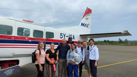 Missionaries from Community Church Virginia posing at Migori Airstrip