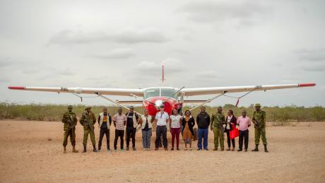 From Left: Anthony Muthuri, Adan Ishaq, Victor Omito, Brian Mtiva, Dr Peter, Sharon Muchoki, Capt Daniel, Grace Ochieng’, Pst Emmy, Dr Philemon, Corp Okinda , Isabella MOHI, Okumu Ezekiel and Pst Gabriel Njoroge at Bura airstrip.