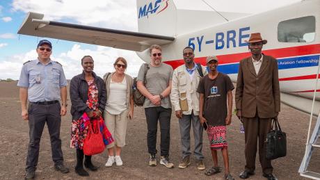 From left to right: David Graaf, MAF pilot; Noella Achieng'; Rachel Gardner; Soren Filbert; Paul Kimanthi; Pastor Bulo; and Mr. Monari at Kargi airstrip.