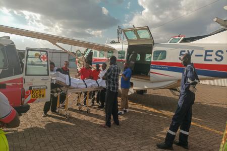 The E plus Ambulance Services' team at Wilson Airport getting patients ready for transfer to Tenwek Hospital.