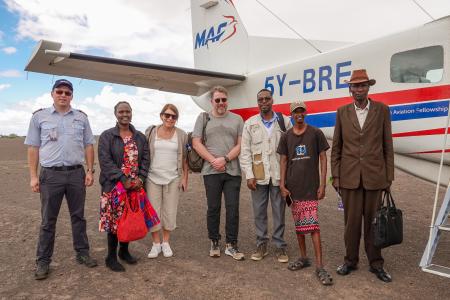 From left to right: David Graaf, MAF pilot; Noella Achieng'; Rachel Gardner; Soren Filbert; Paul Kimanthi; Pastor Bulo; and Mr. Monari at Kargi airstrip.