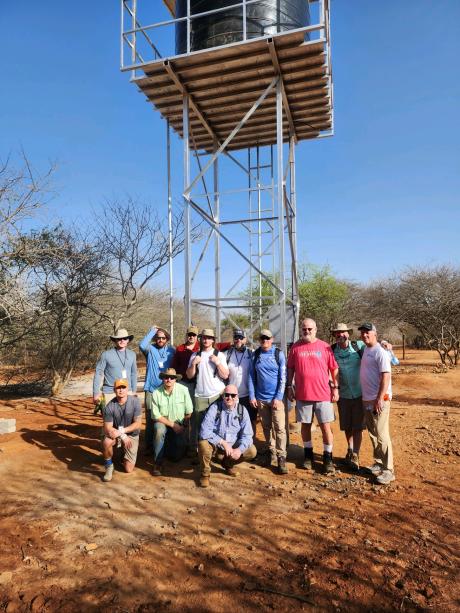 F4H team pose in front of the just completed water well in Timau.