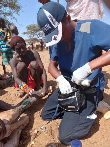 Veterinary doctor attending to an injured Camel.