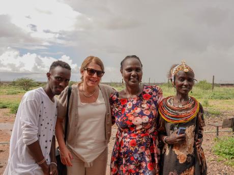 Left to right: John Bulo, Rachel Gardner, Noella Achieng, and a local woman at CITAM church in Kargi.